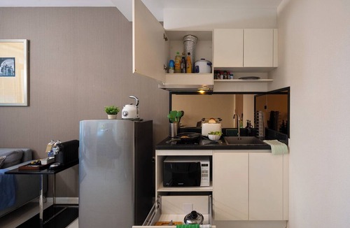 Khlong Tan Nuea Apartment | Balcony & Kitchen · Pool, Gym, Fast Wi-Fi