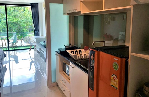 Wichit Apartment | Cozy Pool view Studio Suite | Kitchen | Balcony