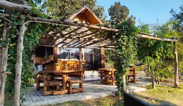 A Bungalow with attached kitchen in rural environment