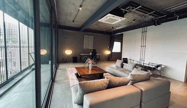 Cozy loft-style rooms, private baths, free Wi-Fi, A/C, and shared spaces.