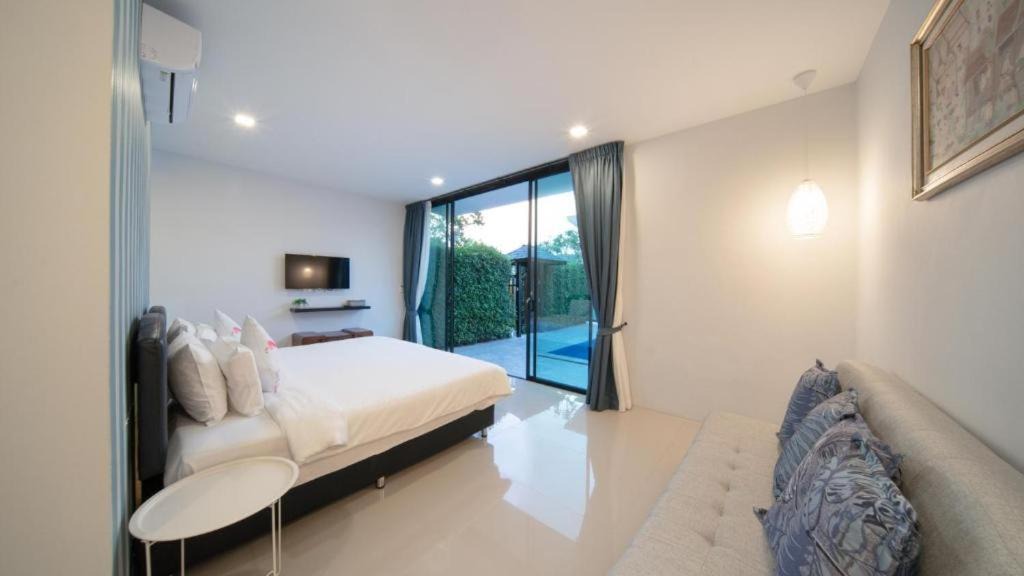 Si Sunthon Villa | Lespalm Resort by Vacayandco