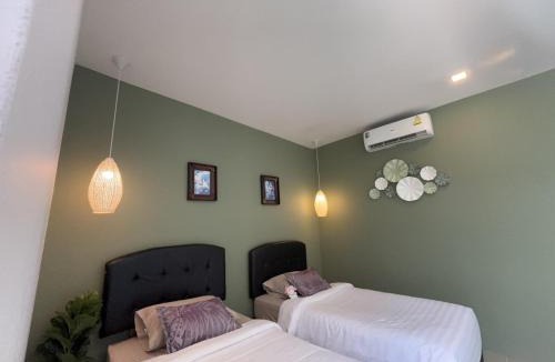 Si Sunthon Villa | Lespalm Resort by Vacayandco
